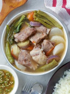  Sinigang na Baboy: Ein süre-würziges Abenteuer für die Geschmacksknospen!